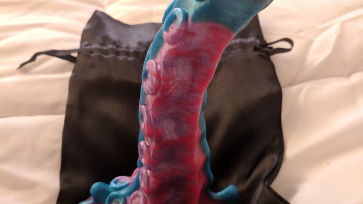 Uberrime tentacle dildo sitting upright on the bag