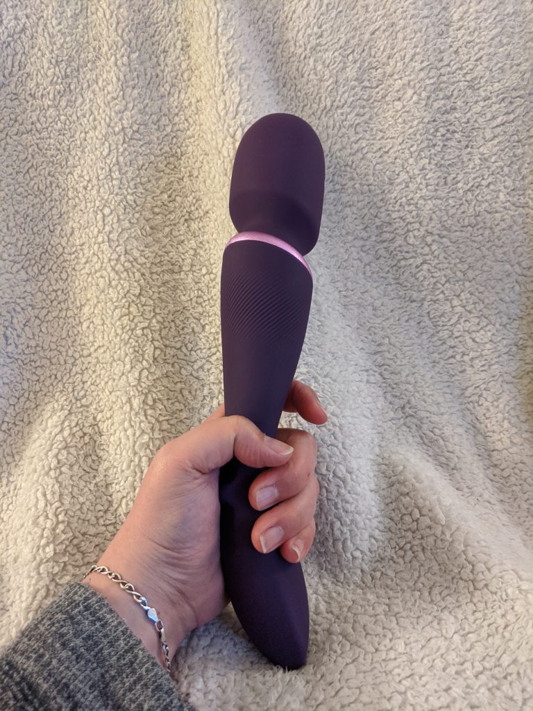 We-Vibe Wand in hand
