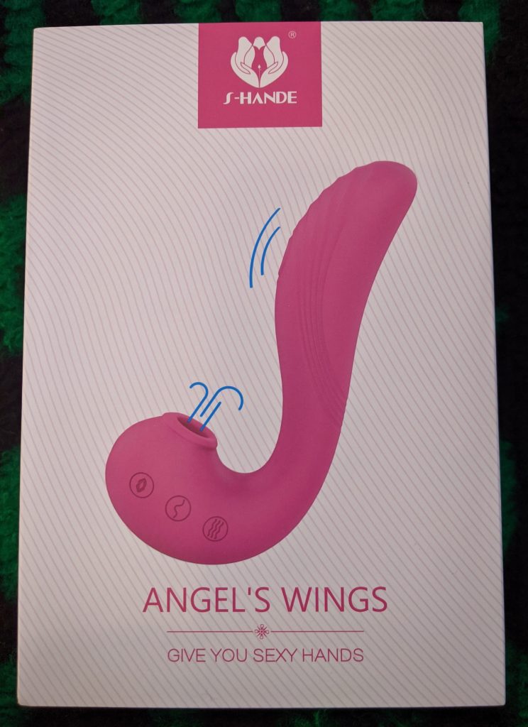 The box is white with an image of the toy on it, and it's captioned "Angel's Wings." Below that, it says "give you sexy hands."
