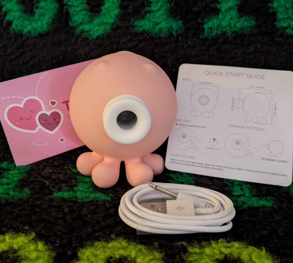 Octopus clit sucker with charging cable and instructions and note