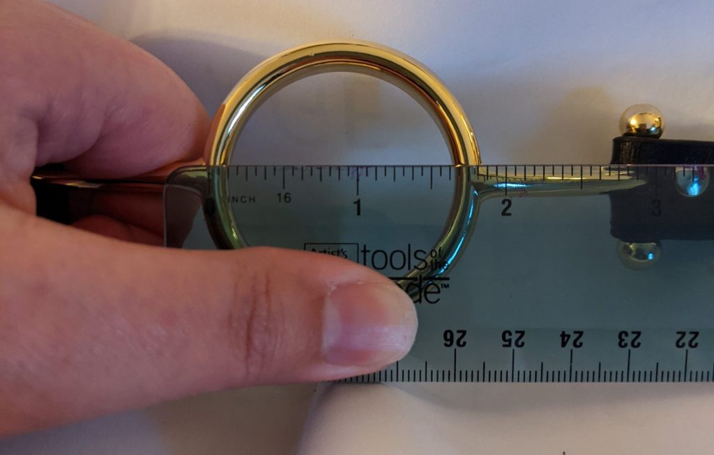 Ruler across o-ring, showing an open space of 1 and 5/8 inches
