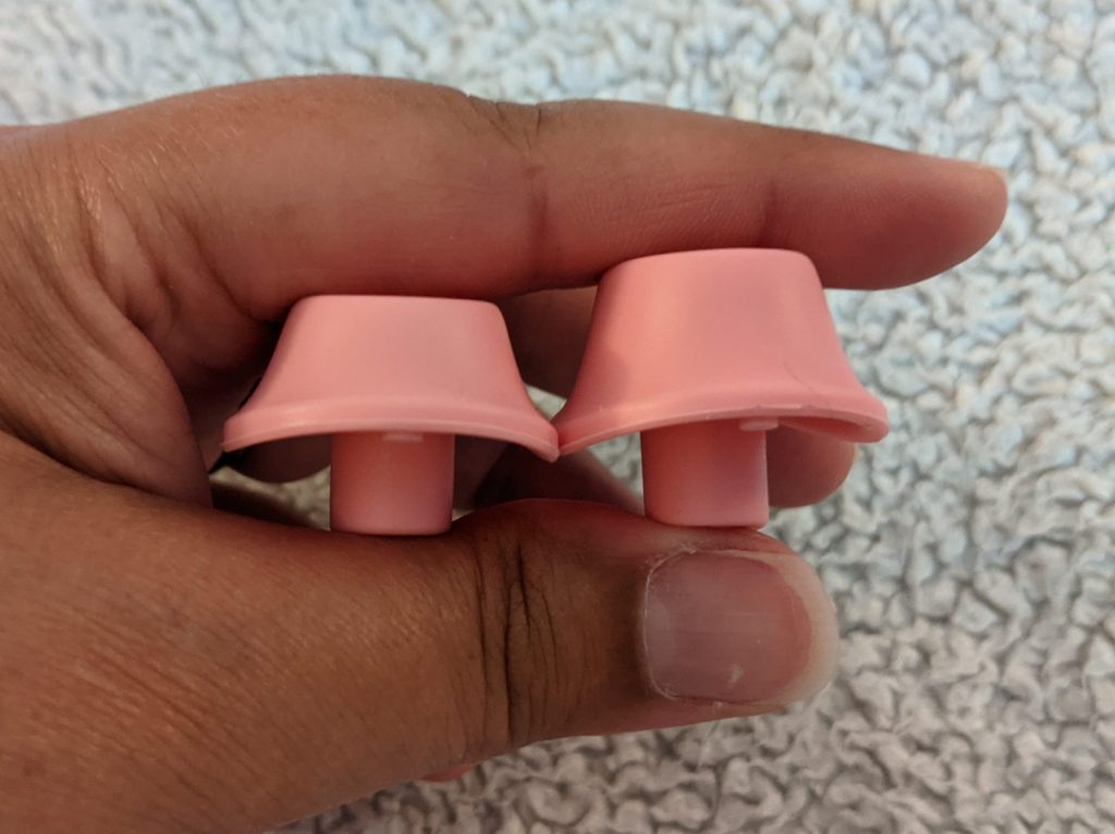 Nozzles from side, showing one as taller than the other