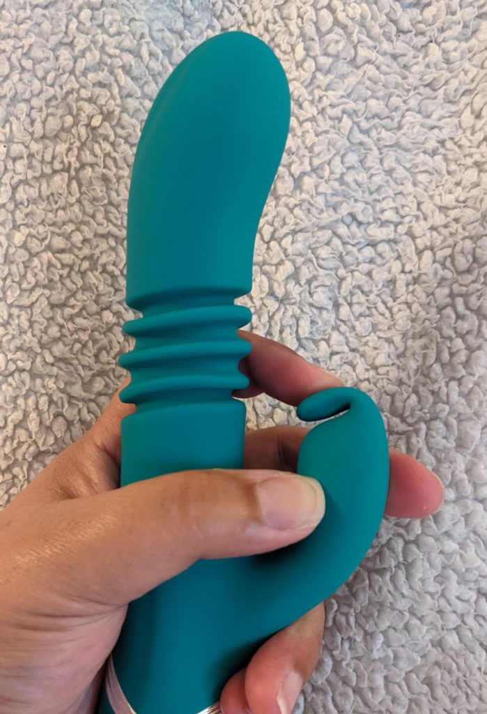 Bending the two little rabbit ears down so they touch the top of the clitoral vibrator