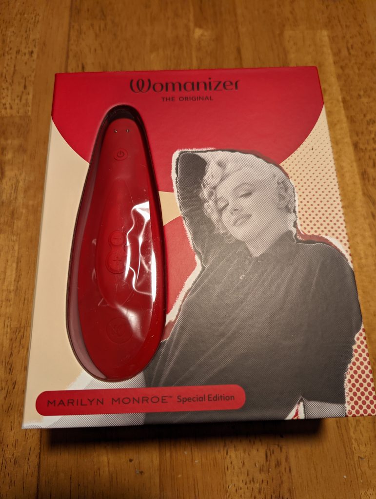 Marilyn edition with Marilyn's image on the front and a clear window to see the toy