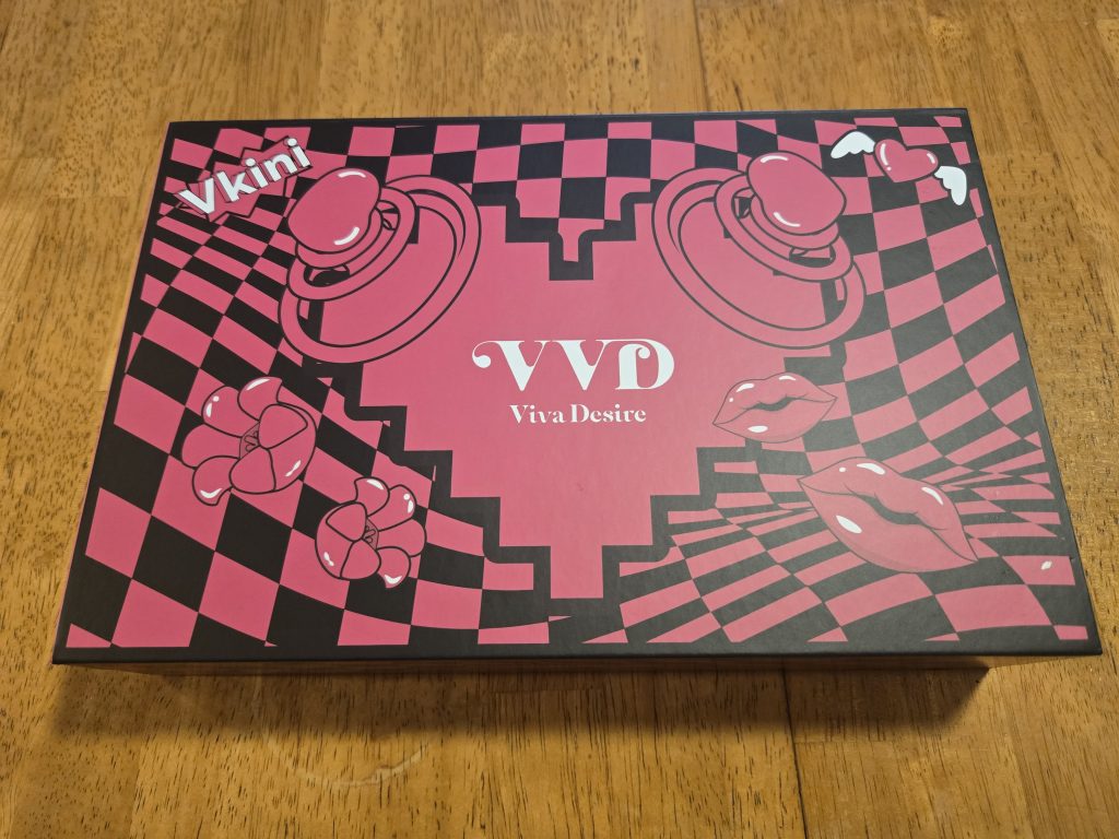 Outer box with cartoonish images of the toys on a retro pink and black checkerboard pattern