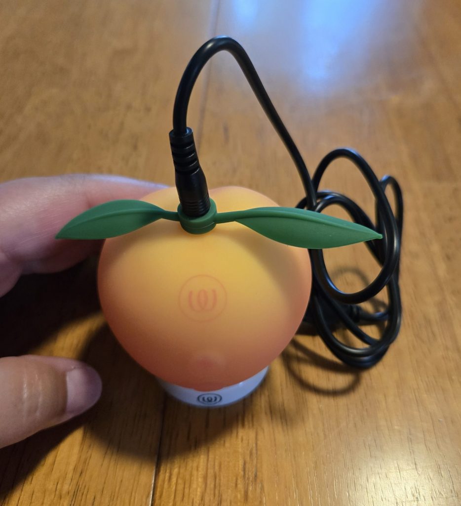 Peach plugged in on stand