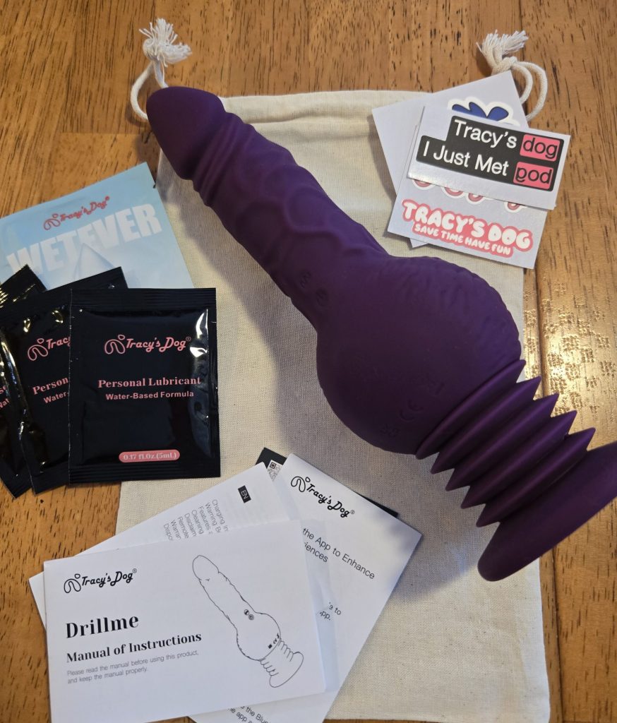 Drillme along with storage bag, stickers, instructions, and lube